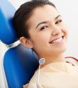 girl sitting for her checkup