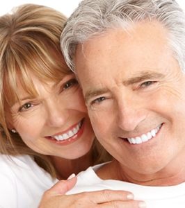 senior couple with bright, white teeth