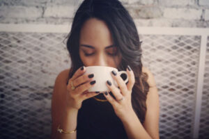 woman drinking a cup of coffee