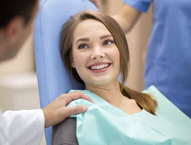 girl talking with her dentist