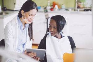 female patient consults with the dentist about restorative dentistry